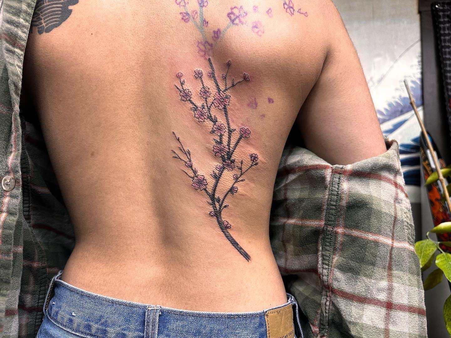 Cherry blossom spine tattoo