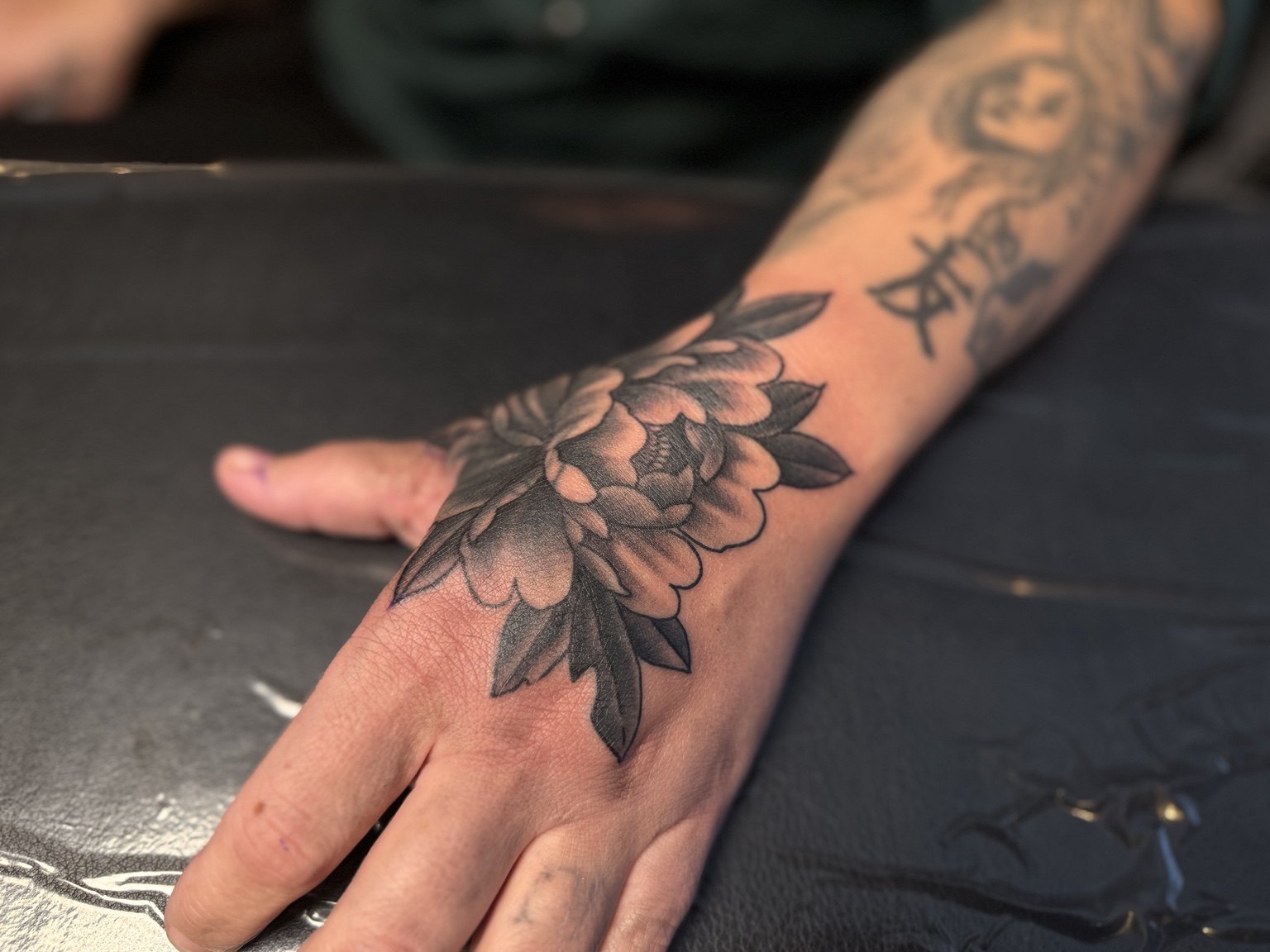Elephant and lion split realism tattoo