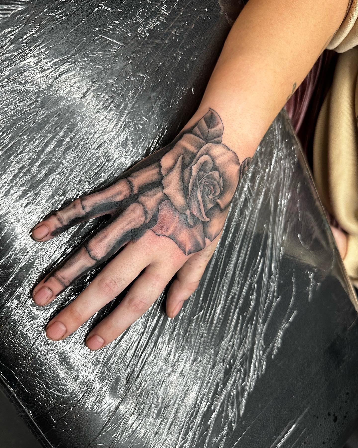 Rose hand tattoo