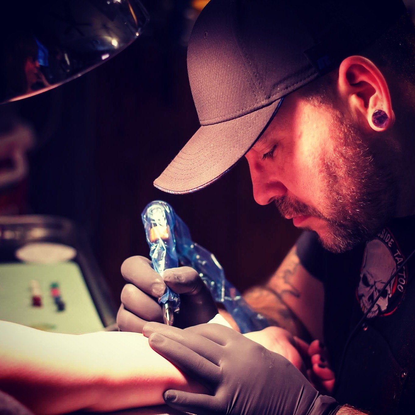 Alex tattooing in studio